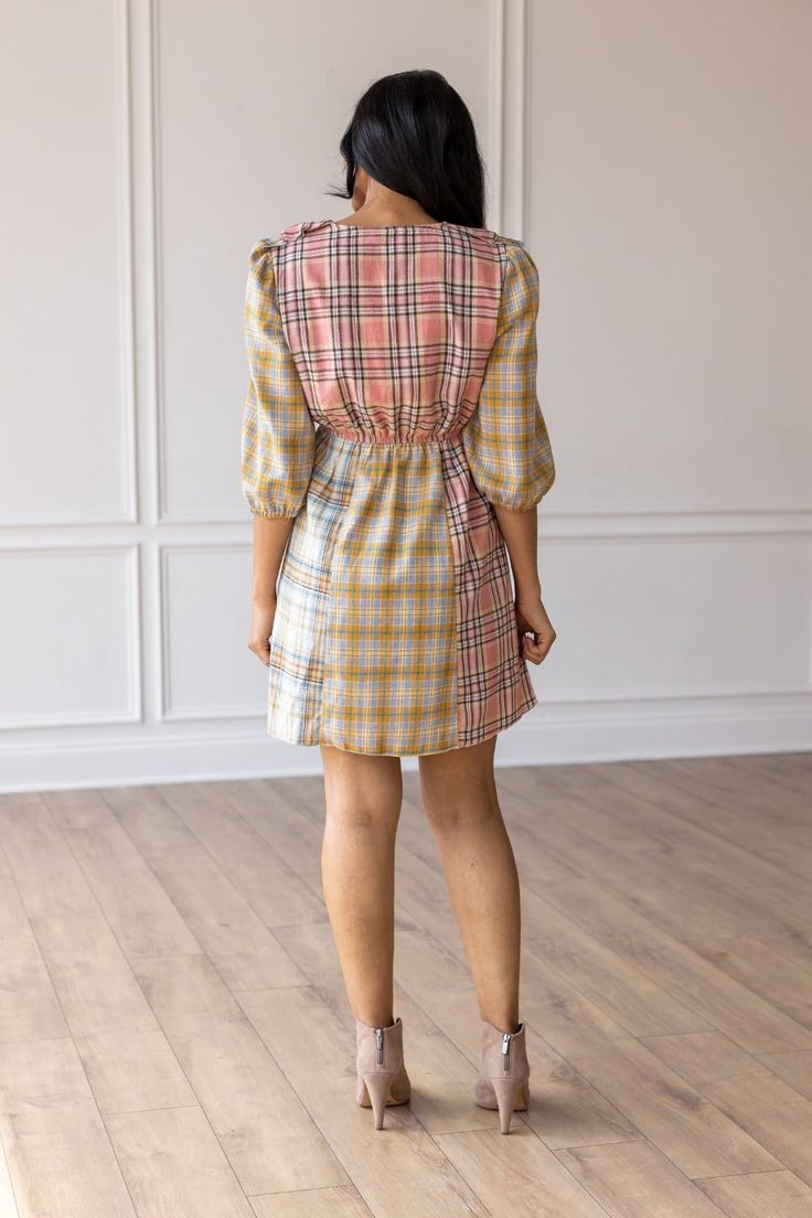 The Pink and Yellow Plaid Dress is an adorable fashion choice that radiates charm and playfulness. Featuring a delightful grid pattern of intersecting horizontal and vertical lines, this dress combines sweet pink and cheerful yellow hues for an irresistibly cute and lively look. Material: 100% Cotton Fit: True to Size Model: Wearing size Small Yellow Plaid Dress, Multi Dress, Yellow Plaid, Plaid Dress, Retro Prints, Body Measurements, Pink And Orange, Print Dress, Multi Color