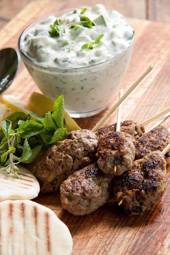 meatballs and vegetables on skewers with dip