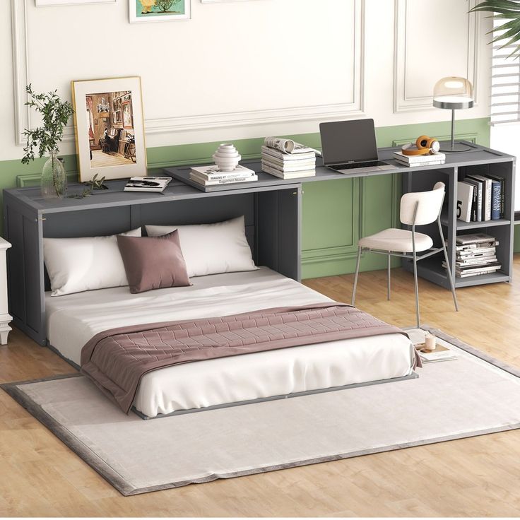 a bed sitting on top of a wooden floor next to a desk