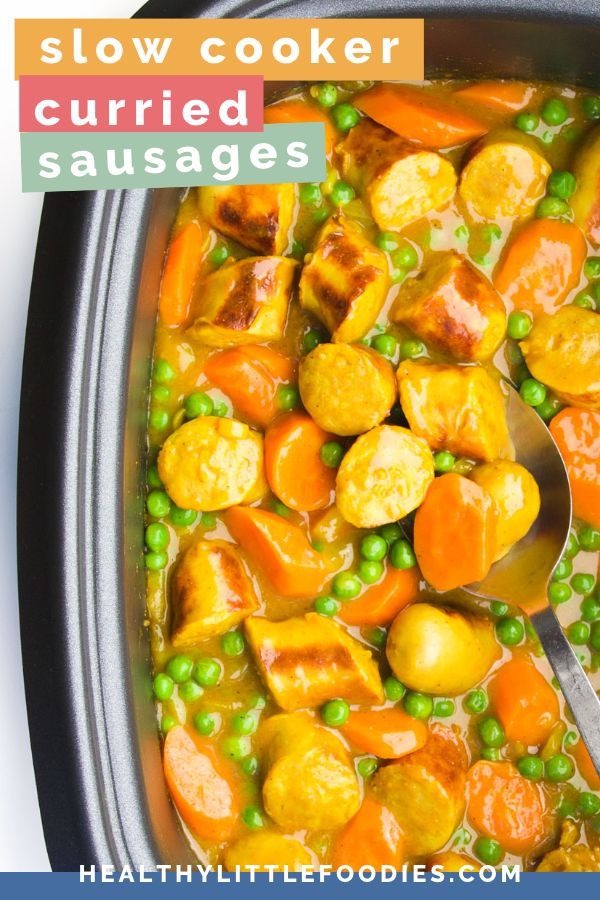 a slow cooker filled with carrots, peas and potatoes