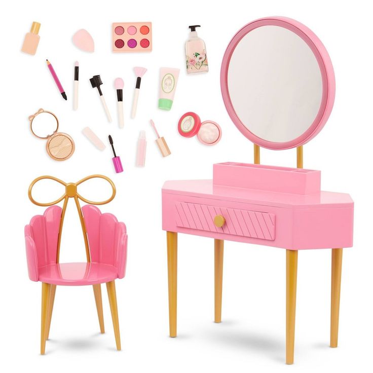 a doll's dressing table and mirror with makeup on it, all in pink