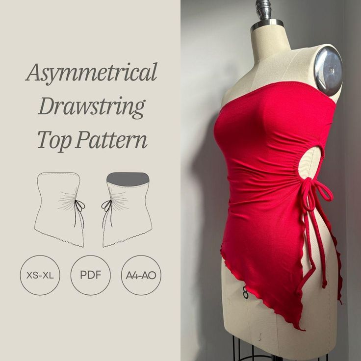 a mannequin wearing a red top with an asymmetrical drawing on it