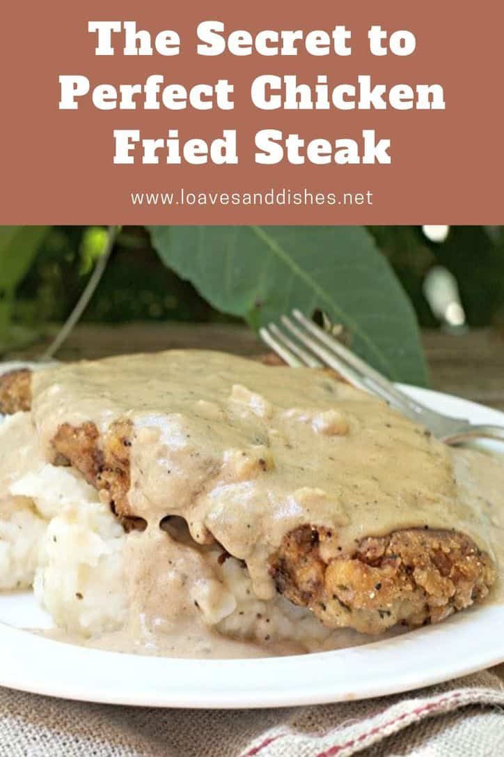 the secret to perfect chicken fried steak on a white plate with gravy and mashed potatoes