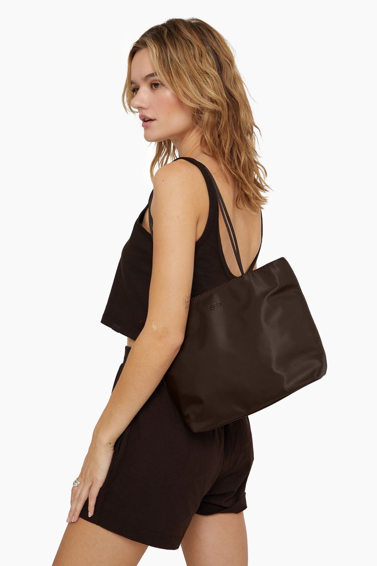 Elevate your style with the Espresso (Brown) City Tote. This mini tote bag features skinny shoulder straps, a magnetic closure, and an interior zipper pocket. Compact yet practical, it's perfect for your on-the-go lifestyle. Brown On-the-go Bag With Adjustable Straps, Elegant Shoulder Bag With Adjustable Straps, Everyday Brown Shoulder Bag With Adjustable Straps, Chic Shoulder Bag With Adjustable Straps For Everyday, Brown Tote Bag With Adjustable Straps, Trendy Everyday Shoulder Bag With Adjustable Straps, Versatile Brown Shoulder Bag With Adjustable Straps, Chic Shoulder Bag With Adjustable Straps For On-the-go, Chic Everyday Bag With Adjustable Straps