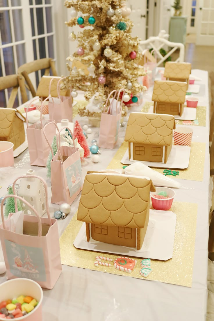 gingerbread houses are sitting on the table