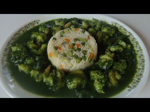 a white plate topped with broccoli and rice