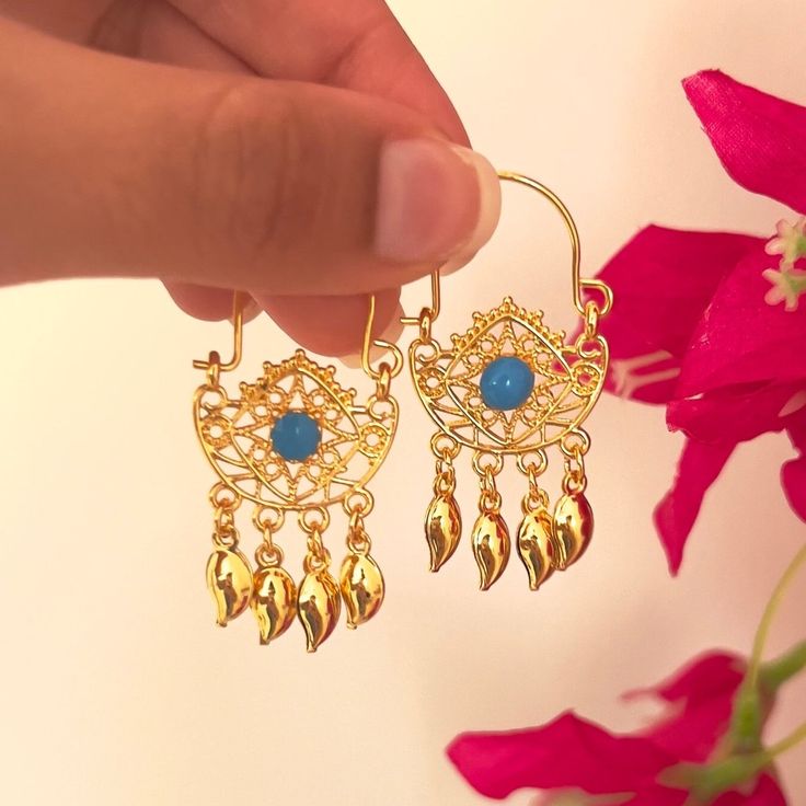 Hi there! A fine set of earrings from the Arabian heritage. 24K gold plated with coins. Wear it to your photoshoot, henna party, or as a wedding guest. Or on Eid! This piece falls under the category of gold imitation. It has the same design as real gold pieces sold in the Middle East. Enjoy it! Since this piece is gold plated, please wear it gently as its color should last you much more than any other piece of jewelry. Please avoid washing or scratching the plating away, and keep out of contact Gold Plated Filigree Earrings For Diwali, Festive Gold Plug Earrings With Latkans, Festive Gold Chandbali Plug Earrings, Gold Chandbali Plug Earrings For Festive, Gold Latkans Earrings For Diwali, Gold Earrings With Latkans For Diwali, Gold Chandbali Danglers, Gold-plated Meenakari Danglers, Gold Dangle Earrings For Diwali