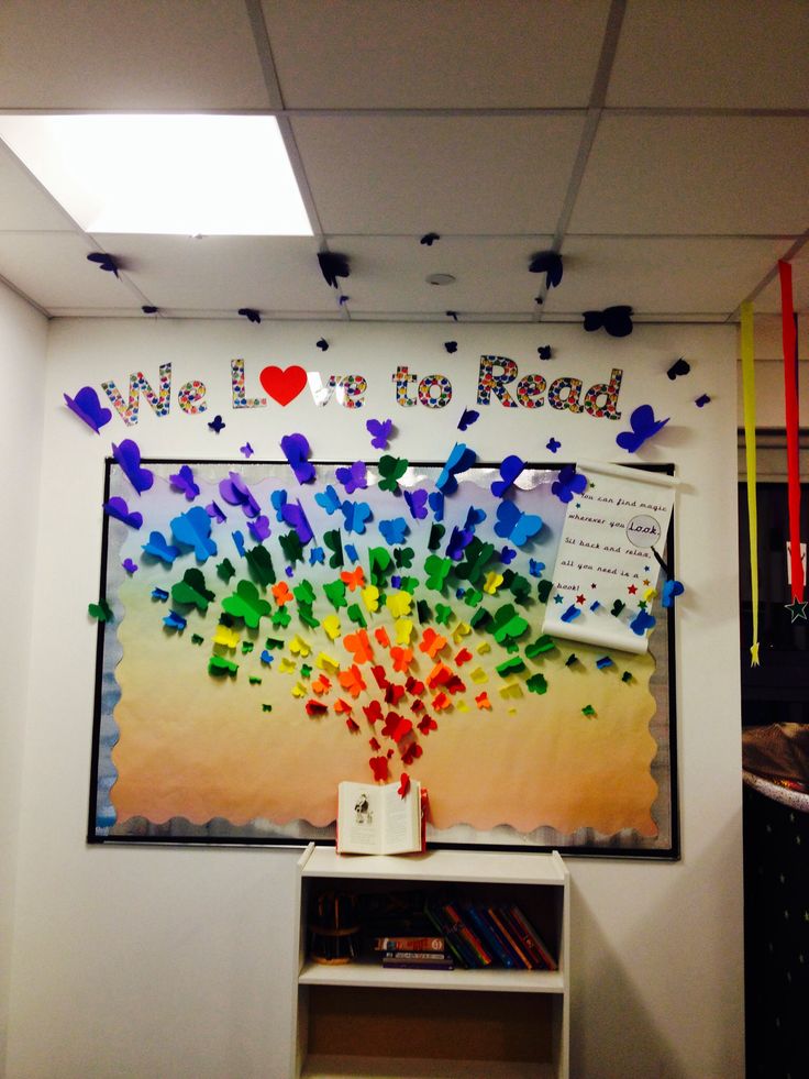 a bulletin board that has been decorated with colorful confetti on it and the words we love to read