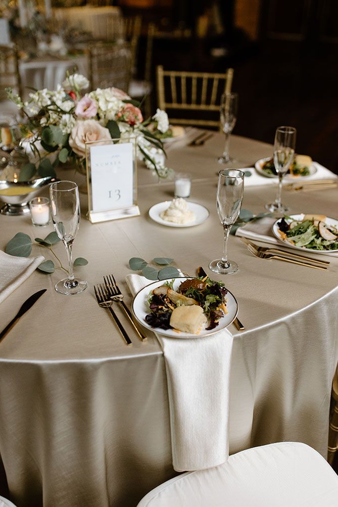 the table is set with silverware, plates and napkins for an elegant dinner