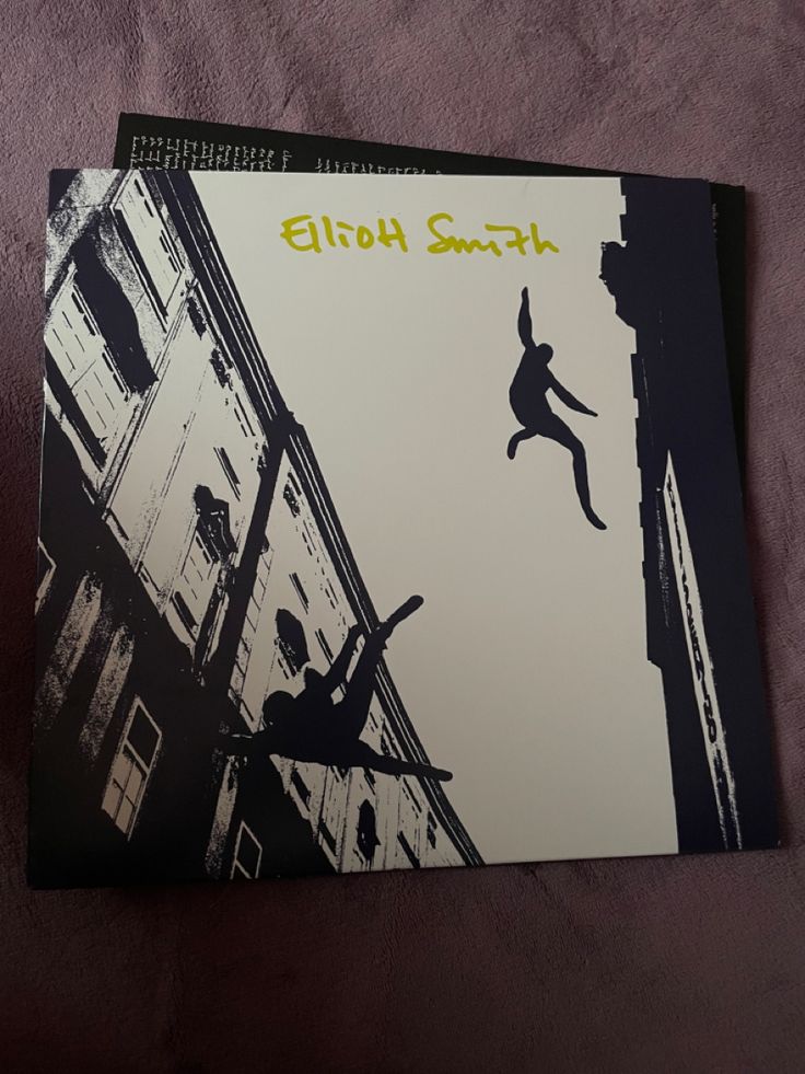 a book with an image of a person jumping off the side of a building