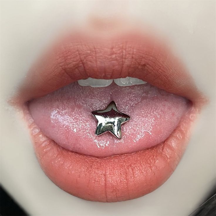 a close up view of a person's lip with a star on it