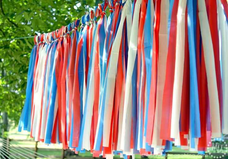 red, white and blue streamers hanging from a line