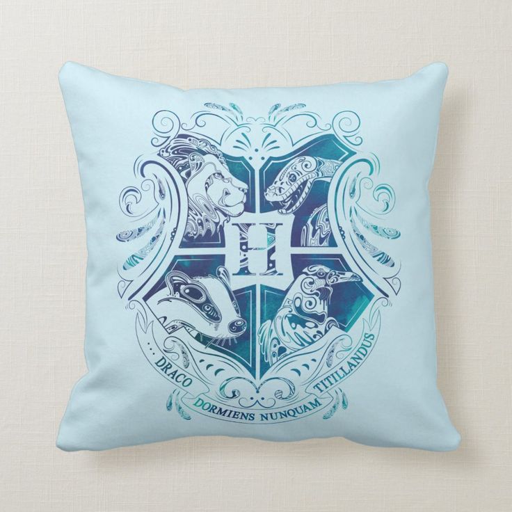 the hogwarts crest on a blue throw pillow from zazzler co uk