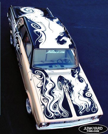 an old car painted with black and white designs