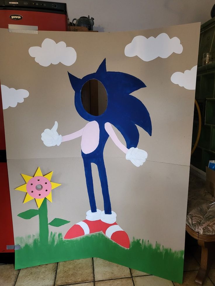 a cardboard cutout of sonic the hedgehog standing in front of a sunflower