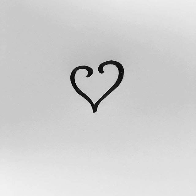 a black and white photo with a heart drawn on the back of it's side