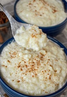 an old - fashioned rice pudding is served in blue bowls