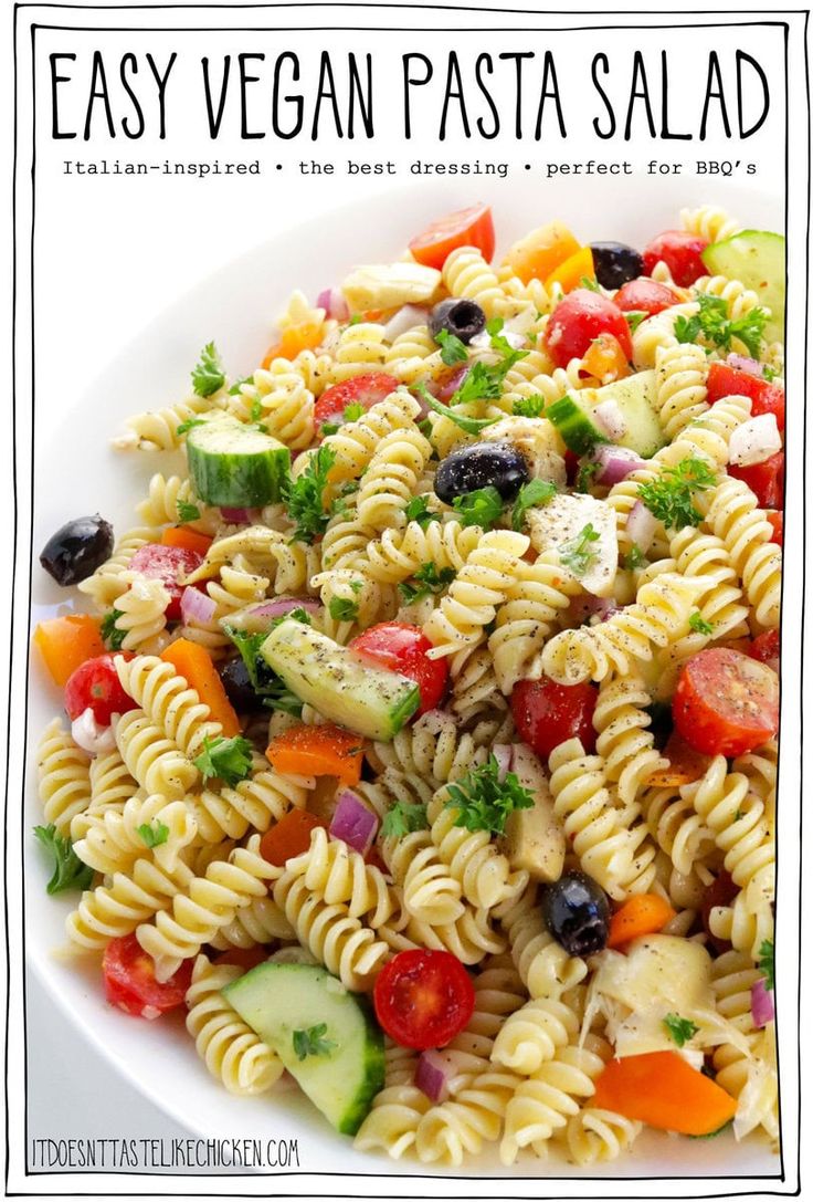 pasta salad in a white bowl with the title text overlay reads easy vegan pasta salad