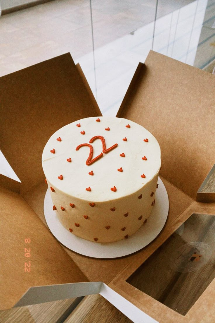 a cake in a box with the number twenty on it