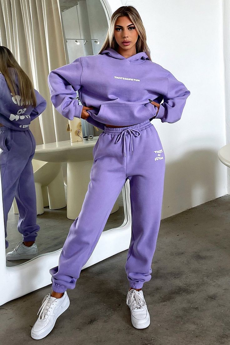 Obsessing over the Series 3 sets! She offers a soft fleece inside, an elasticated waistband, a front pocket and a puffed up 'THATSSOFETCH' logo at the front and back. Pair her with the matching Sweatpants and white runners for an off duty look this winter. Purple And White Sweatpants, Athleisure Fall Tracksuit With Kangaroo Pocket, Fall Athleisure Tracksuit With Kangaroo Pocket, Fall Sportswear Tracksuit With Kangaroo Pocket, Fleece Tracksuit With Hoodie And Pockets, Fleece Hoodie Tracksuit With Pockets, Cozy Fit Winter Sweats With Elastic Waistband, Fleece Tracksuit With Kangaroo Pocket In Athleisure Style, Cozy Fit Sweats With Elastic Waistband For Winter