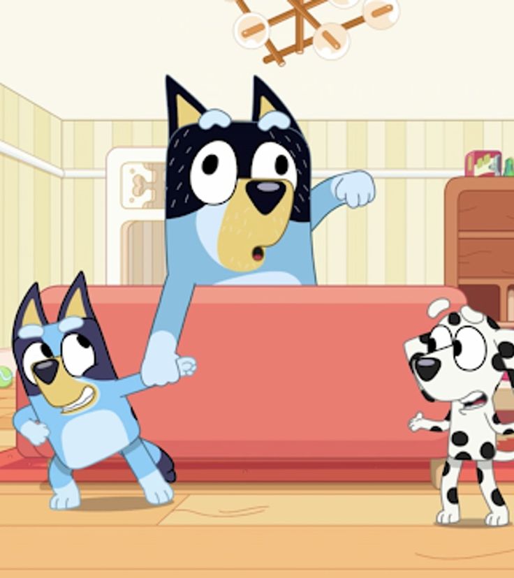 three cartoon dogs standing in front of a couch with one dog pointing at the other