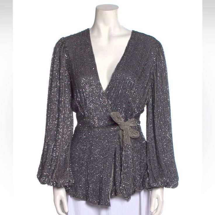 Retrofte Blouse Silver Sequin Embellishments Long Sleeve With V-Neck Sash-Tie Closure At Front Waist: 28.75" Length: 24.5" Bust: 33.75" Color: Silver Fabric: 100% Viscose; Combo 100% Viscose Clothing Size: M Festive V-neck Evening Blouse, Elegant V-neck Holiday Tops, Glamorous V-neck Cocktail Tops, Elegant V-neck Tops For Festive Occasions, Glamorous Formal V-neck Blouse, V-neck Sequin Blouse For Evening, Glamorous V-neck Blouse For Party Season, Holiday Party V-neck Blouse, Glamorous V-neck Blouse