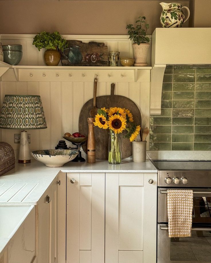 a kitchen with sunflowers on the counter