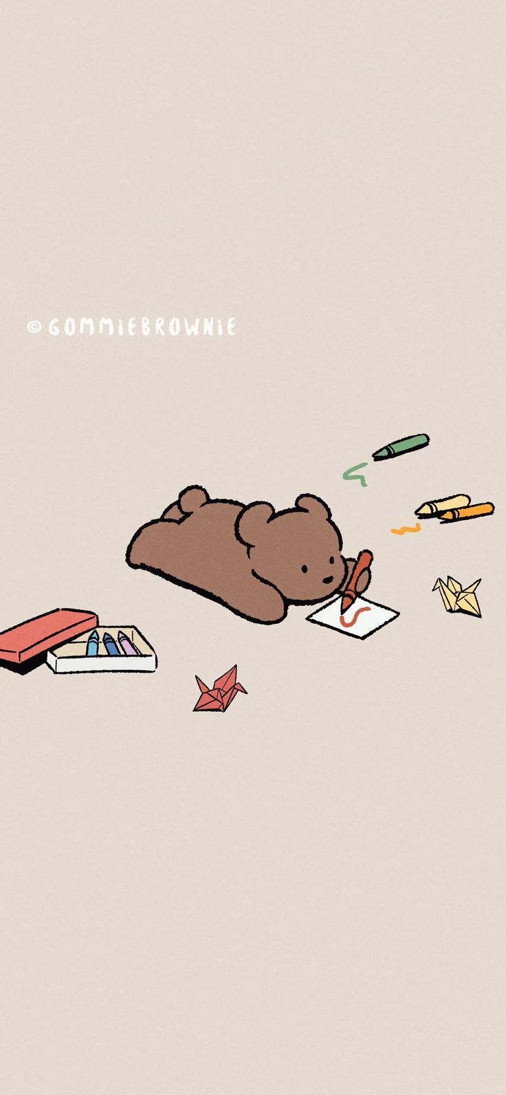 a brown bear laying on top of a pile of books next to an origami airplane