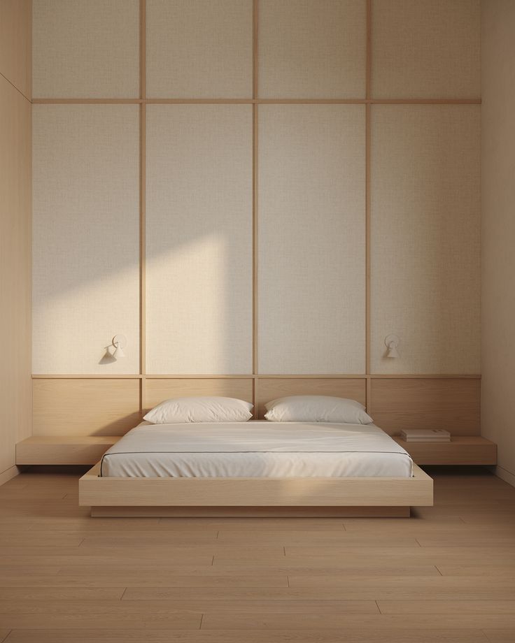 a bed sitting in the middle of a room next to a wall with wooden paneling