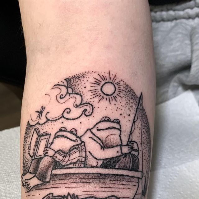 a black and white photo of a boat on the water with sun in background tattoo