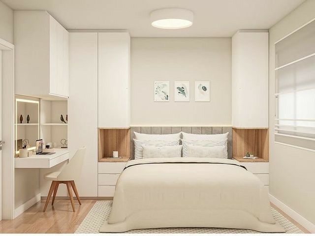 a bedroom with a bed, desk and shelves in the corner next to each other