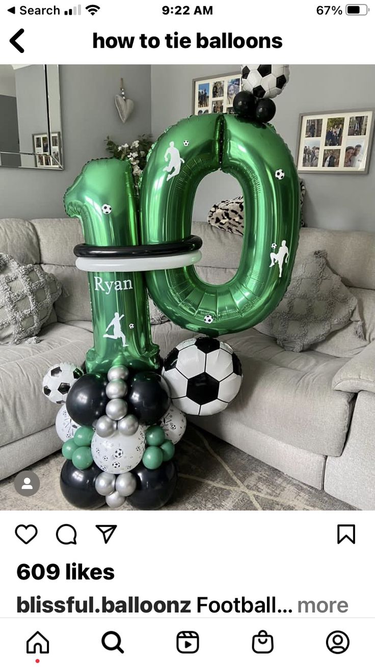 an inflatable number one balloon sitting on top of a table next to a couch