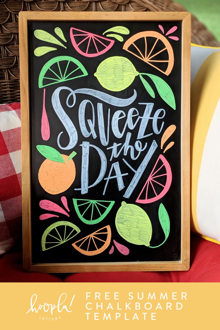 a chalkboard sign that says squeeze the day with oranges and lemons on it