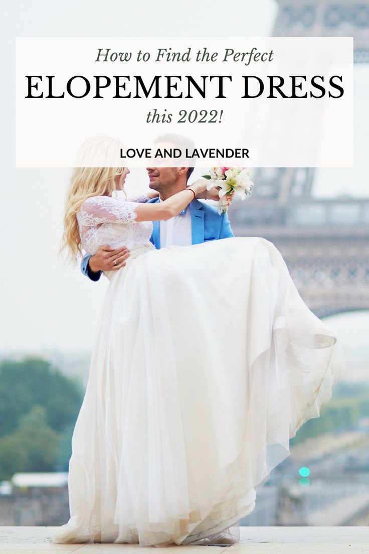 a man carrying a woman on his back in front of the eiffel tower