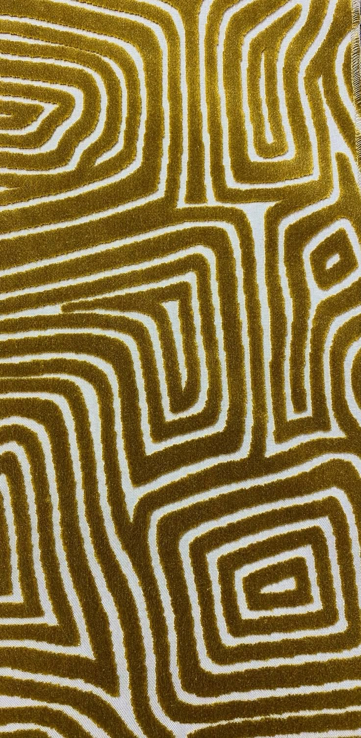 a brown and white area rug with lines on it