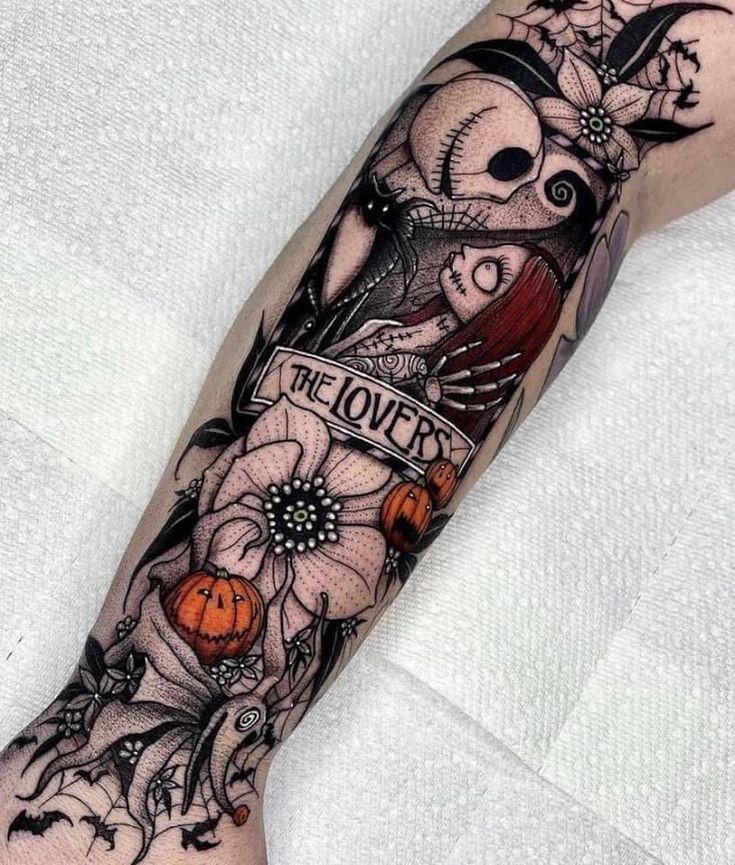 a person with a tattoo on their arm that says the lover and has flowers in it