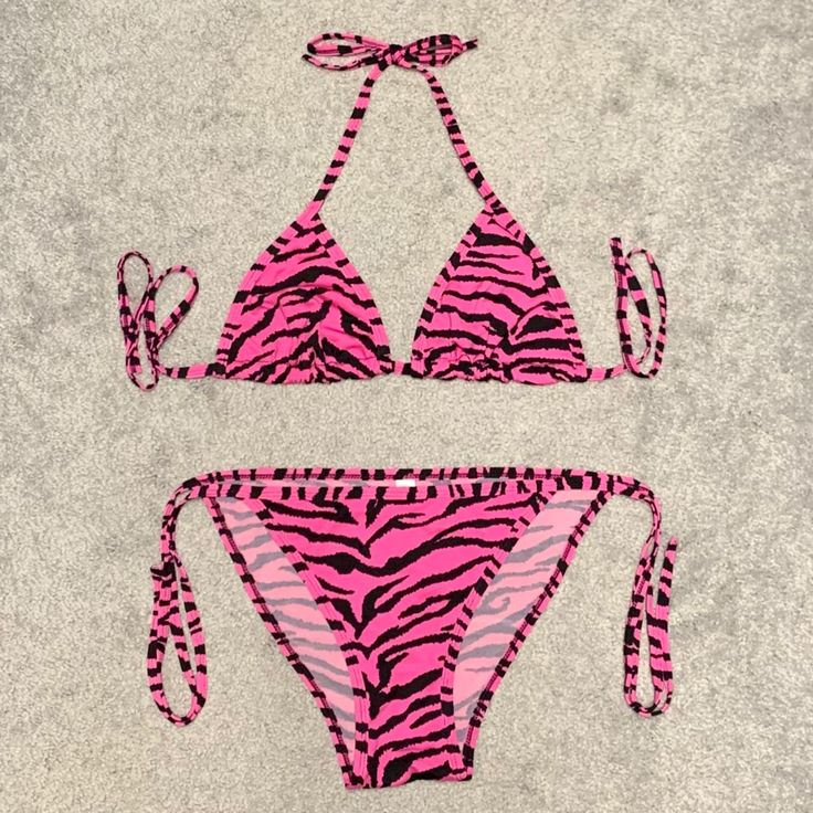 ‘Pink Zebra’ Chuns String Bikini. Mesh Lining In The Top And Front Of The Bottoms. Adjustable Triangle Top. No Size Tag But It’s Completely Adjustable And Looks To Fit A Small/Medium. New And Never Worn. Trendy Fitted Pink Swimwear, Pink Halter Neck Swimwear For Summer, Pink Triangle Top Swimwear For Party, Pink Stretch Swimwear With Triangle Top, Trendy Pink Triangle Top Swimwear, Pink Triangle Top Stretch Swimwear, Pink Stretch Triangle Top Swimwear, Pink Tropical Triangle Top Swimwear, Fitted Zebra Print Triangle Top Swimwear