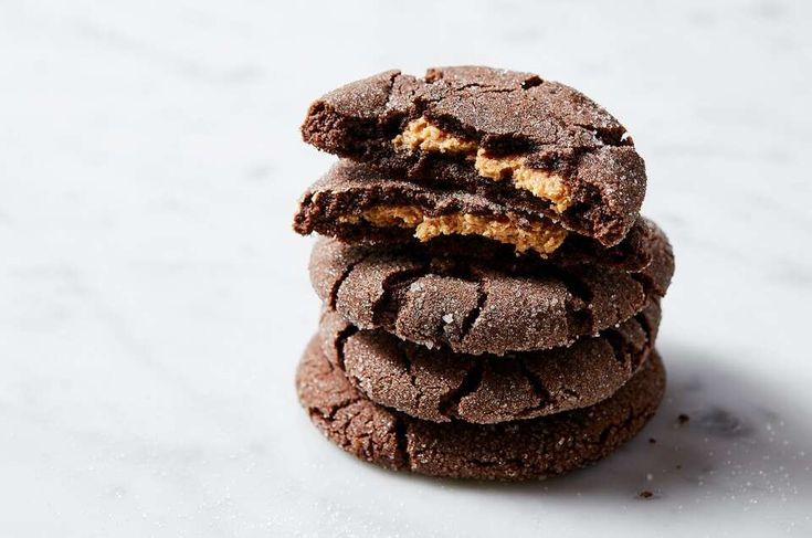 three chocolate cookies stacked on top of each other