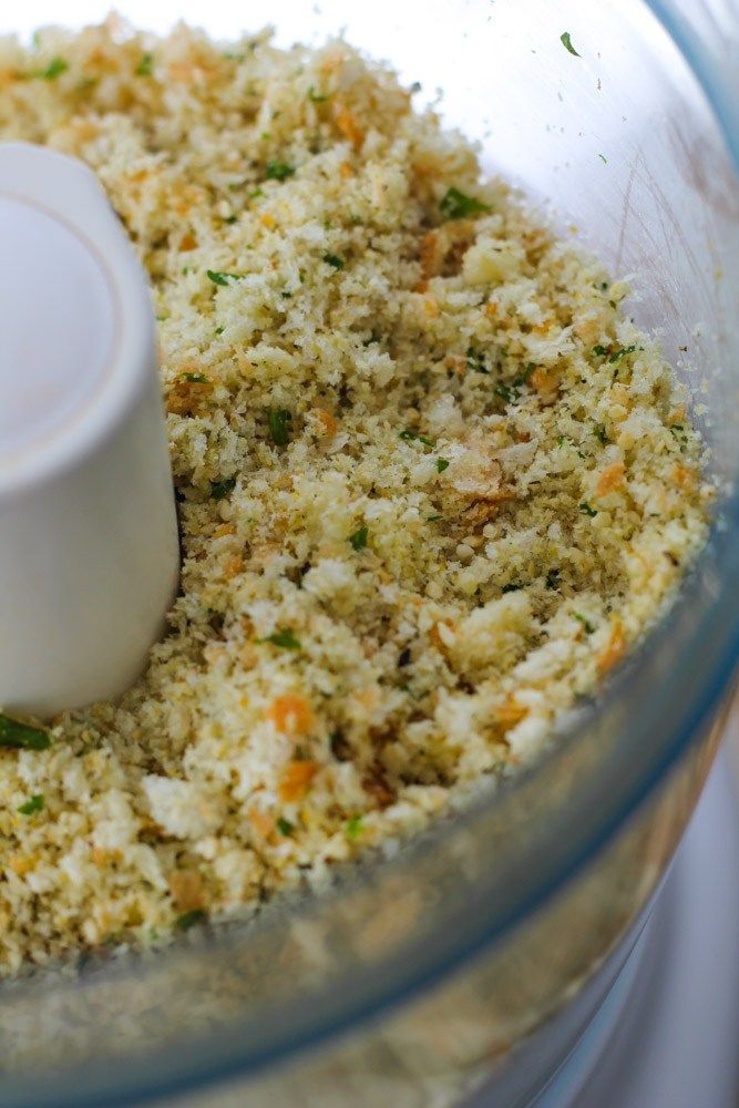 a food processor filled with rice and vegetables