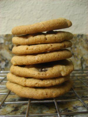 a stack of cookies sitting on top of a metal rack