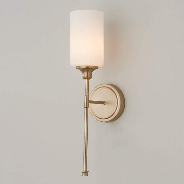 a wall light with a white shade on it