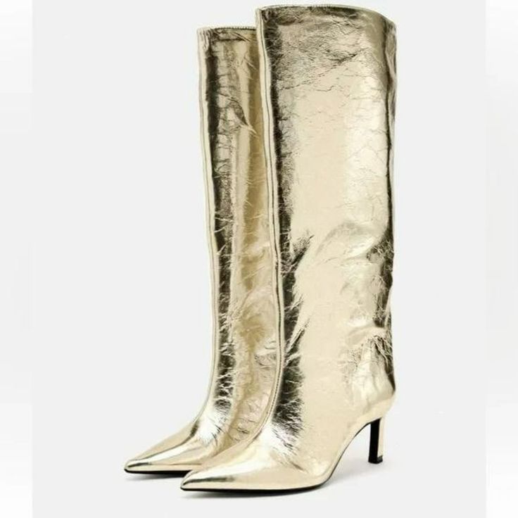 Heeled Knee High Boots. Metallic Effect. Pointed Toe. Heel Height: 2.6 Inches (6.5 Cm) Winter Party Knee-high Closed Toe Boots, Winter Knee-high Closed Toe Boots For Party, Spring Party Knee-high Closed Toe Boots, Elegant Knee-high Boots For Spring, Chic Gold Heels For Winter, Gold High Heel Boots For Winter, Gold High Heel Boots For Spring, Gold Heeled Boots With Round Toe For Winter, Elegant High Ankle Boots For Party