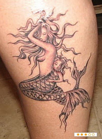 a woman with a mermaid tattoo on her leg