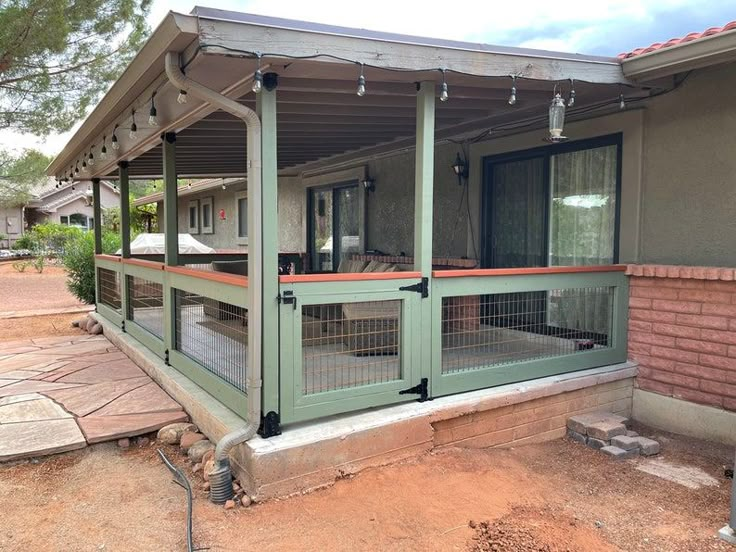 a house with a covered porch in the front yard