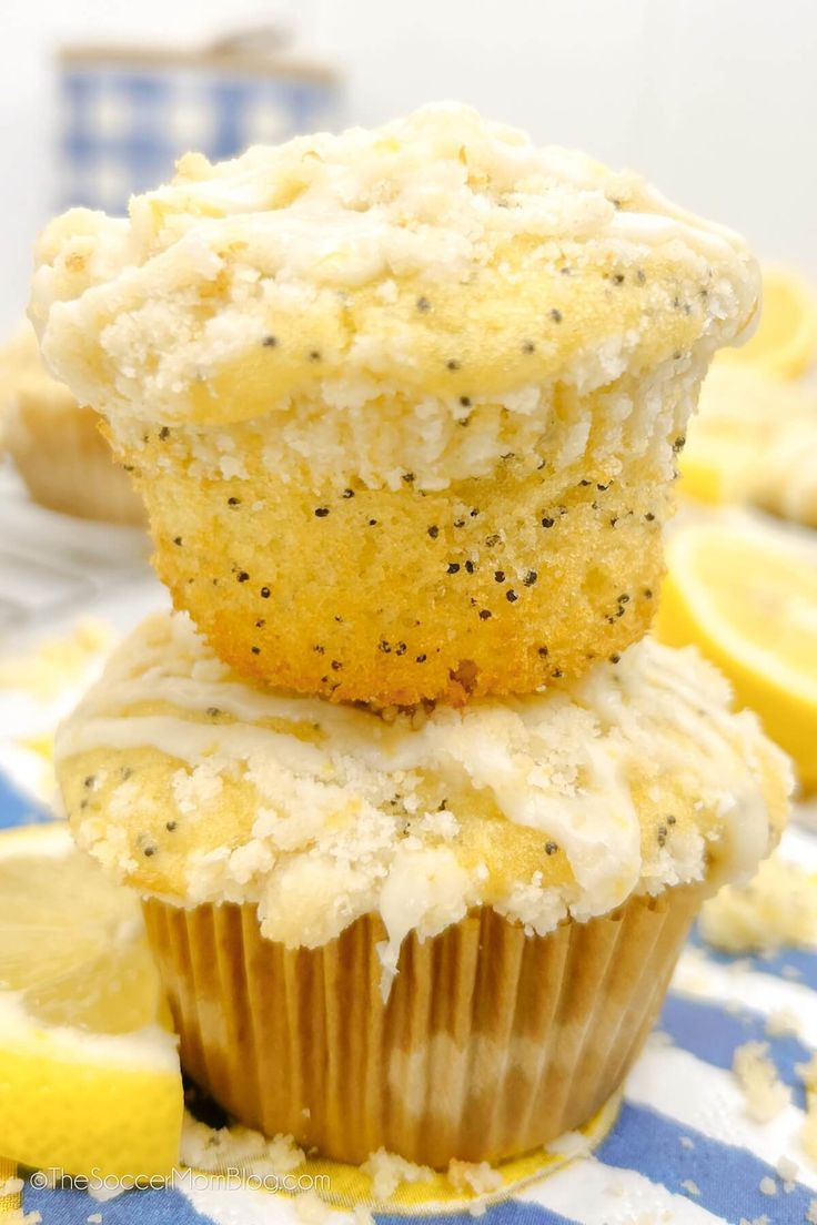 two lemon poppy seed muffins stacked on top of each other