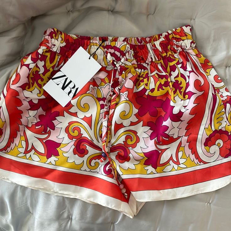 Never Worn With Tag Lightweight Silk Feel Zara Shorts Perfect For Any Occasion (More Like A Small). Chic Printed Bottoms For Beach Season, Vibrant Summer Bottoms For A Day Out, Red Zara Bottoms For Vacation, Chic Multicolor Beach Shorts, Chic Red Beach Season Bottoms, Cheap Zara Women's Shorts, Chic Red Bottoms For Beach Season, Zara Summer Shorts, Zara Beach Shorts For Spring