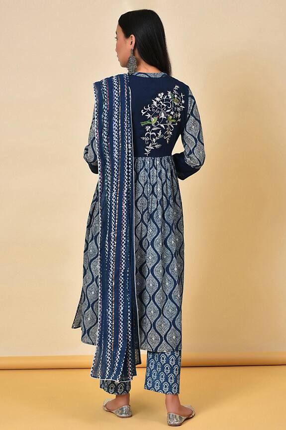 Indigo anarkali with geometric print and back embroidered bodice. Paired with dupatta and printed pyjama pant.
Component: 3
Pattern: Printed
Type Of Work: Geometric
Neckline: Mandarin 
Sleeve Type: Long Sleeves
Fabric: Cotton
Color: Blue
Other Details: 
Side pockets
Back embroidered bodice
Printed pyjama pant
Occasion: Puja - Aza Fashions Block Print Salwar Kameez For Diwali With Traditional Drape, Cotton Anarkali Set With Mirror Work For Eid, Anarkali Salwar Kameez With Block Print For Festivals, Traditional Drape Salwar Kameez With Block Print For Diwali, Diwali Salwar Kameez With Block Print And Traditional Drape, Diwali Block Print Salwar Kameez With Traditional Drape, Diwali Traditional Drape Block Print Salwar Kameez, Bollywood Style Festive Dupatta With Block Print, Eid Churidar With Block Print In Traditional Drape