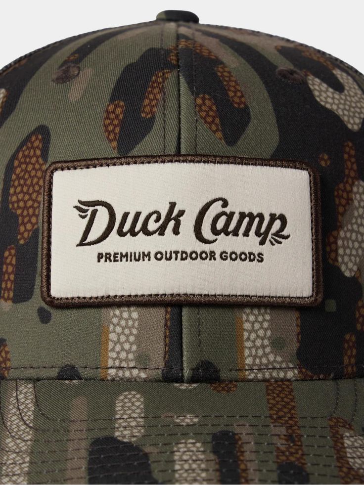 Look good, hunt good in a Duck Camp signature camo hat made of 100% Recycled Materials. Good for you, good for habitat. - Recycled materials make this hat better for everyone without sacrificing performance features- 6-panel structure- Snap back adjustment Outdoor Camouflage Baseball Cap, Military Style Snapback Hat With Curved Brim For Outdoor, Military Style Snapback Hat With Curved Brim, Green Snapback Hat With Logo Patch For Outdoor, Outdoor Military Hat With Curved Bill, Military Hat With Curved Bill For Outdoor, Military Style Flat Brim Trucker Hat For Outdoor, Camouflage Flat Brim Trucker Hat For Outdoor, Camouflage Hats With Curved Bill For Outdoor Activities