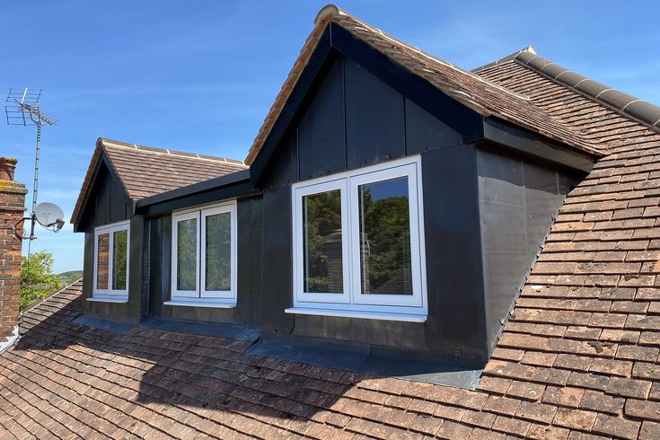 the roof of a house with two windows