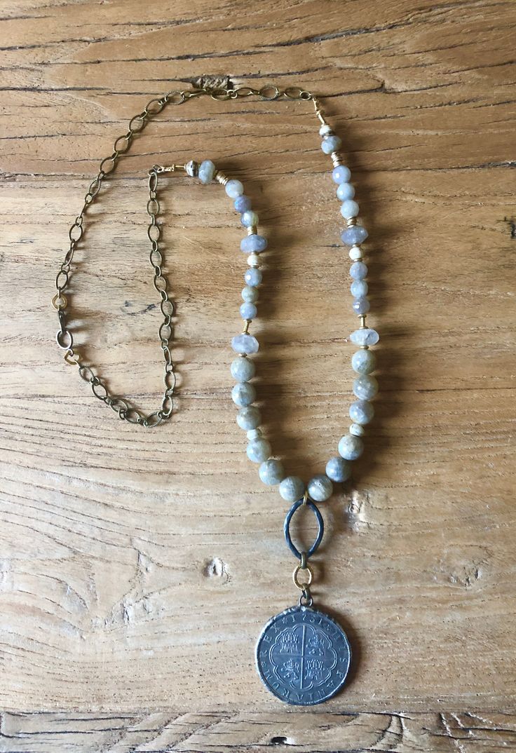 Handbeaded labradorite with a beautiful Old World coin. -28” adjustable length Adjustable Labradorite Necklaces With Round Beads, Adjustable Round Labradorite Necklace, Adjustable Round Labradorite Necklaces, Adjustable Labradorite Necklace, World Coins, Brass Pendant, Hand Beading, Old World, Long Necklace